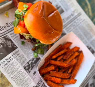 Sunny Daze Smokehouse signature dishes Pulled Pork Sandwich
Three Meat Platter
The Classic Beach Burger